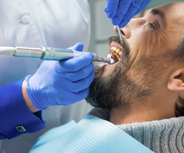 Dental hygienist polishing patient's teeth